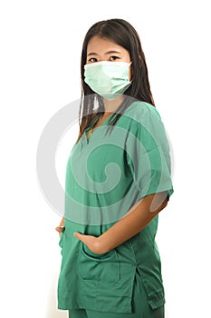 Young beautiful Asian Korean medicine doctor woman or hospital nurse in scrubs using protective medical face mask in prevention