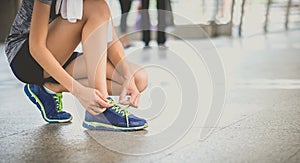 Young beautiful asian model woman jogger running in morning sit