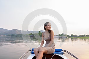 Young beautiful Asian tourist woman traveling with boat in Thailand