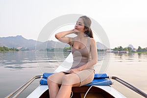 Young beautiful Asian tourist woman traveling with boat in Thailand