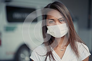 Young beautiful Asian woman or hospital nurse using protective medical face mask