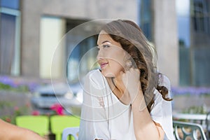 Young beautiful asian woman looking up