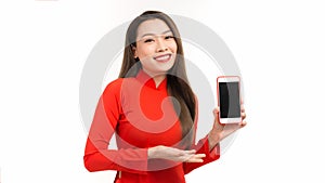 Young beautiful Asian woman pointing at black empty space on smart phone background can use for advertising or product presenting