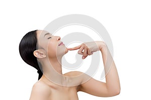 Young beautiful Asian woman pointing at chin in white isolated background