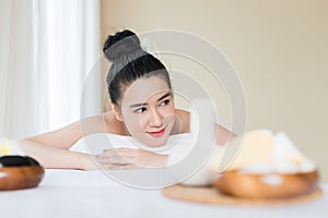 Young beautiful Asian woman relaxing in the spa massage