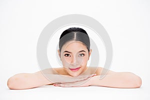 Young beautiful Asian woman with smooth and perfect skincare in white isolated background