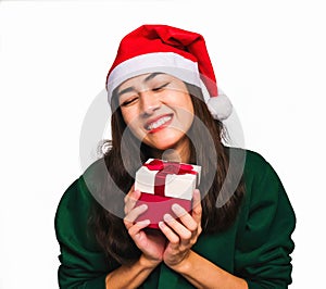 Young beautiful asian woman wore green sweater and santa hat,Excited, surprised and happy for a box gift with red bow isolated on