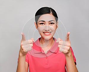 Young beautiful asian woman wore pink t shirt, Showed yes,perfect and Correct expression , on gray background