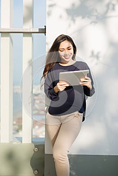 Young beautiful Asian woman working with laptop/internet/online shopping at outdoor park, smile/fresh and happy relaxing feeling