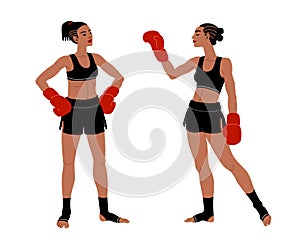 Young beautiful athletic girls greet each other. Muay Thai boxers in black gym shorts before the fight.