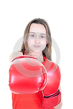 Young beautiful athletic woman hitting in boxing gloves with long hair Isolated white background