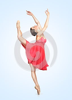 Young beautiful ballerina on a blu background