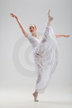 Young and beautiful ballet dancer posing isolated