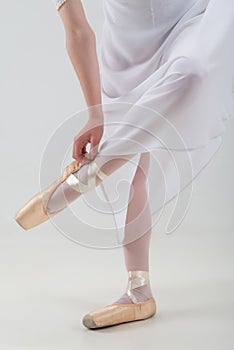 Young and beautiful ballet dancer posing isolated