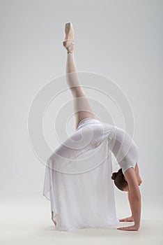 Young and beautiful ballet dancer posing isolated