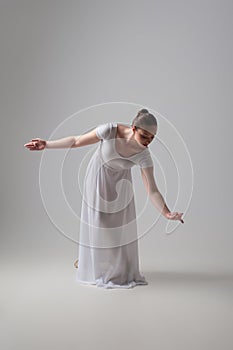 Young and beautiful ballet dancer posing isolated