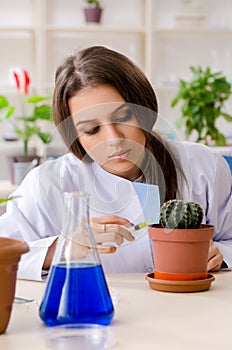 The young beautiful biotechnology chemist working in the lab