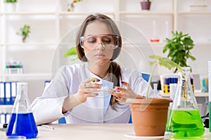 The young beautiful biotechnology chemist working in the lab