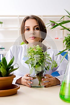 The young beautiful biotechnology chemist working in the lab