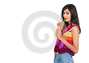 Young Iindian girl drinking soft drink on isolated white background