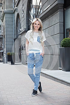 Young beautiful blonde dressed in pants