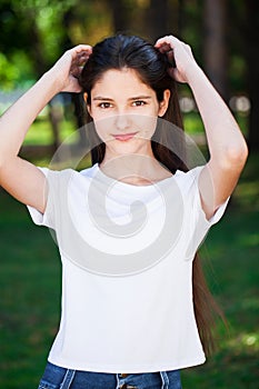 Young beautiful blonde girl with bare shoulders