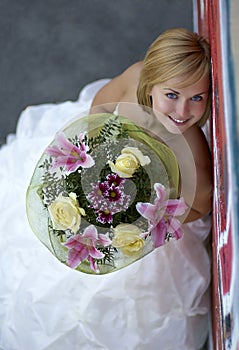 Young beautiful blonde girl with a bouquet of flowers