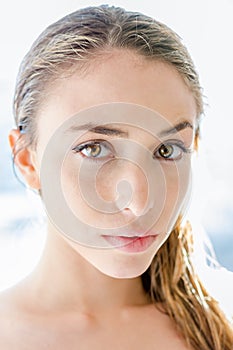 Young beautiful blonde lady close up with sunlight on her hair