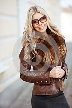 Young beautiful blonde woman wearing sunglasses