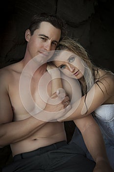 Young beautiful bridal couple having fun together at the beach