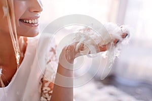 Young beautiful bride in boho style and white feathers