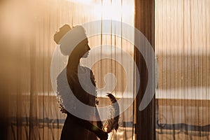 Young beautiful bride in boho style and white feathers