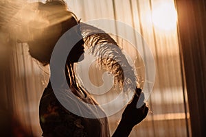 Young beautiful bride in boho style and white feathers