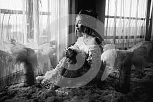 Young beautiful bride in boho style and white feathers