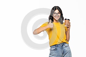Young beautiful brunette woman drinking cup of coffee over isolated white background happy with big smile doing ok sign, thumb up