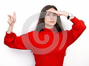 Young beautiful brunette woman in red sweater thinking looking to the side at blank copy space, isolated over white background