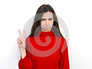 Young beautiful brunette woman in red sweater thinking looking to the side at blank copy space, isolated over white background