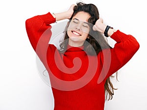 Young beautiful brunette woman in red sweater thinking looking to the side at blank copy space, isolated over white background