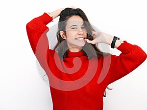 Young beautiful brunette woman in red sweater thinking looking to the side at blank copy space, isolated over white background