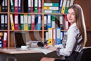 Young Beautiful Business Lady Portrait working at Office Desk