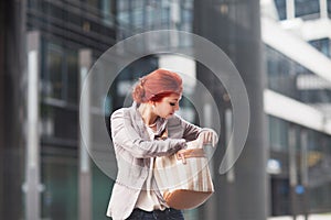 Young beautiful business woman holding purse