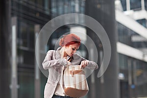 Young beautiful business woman holding purse