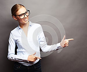 young beautiful business woman showing something or copyspase fo