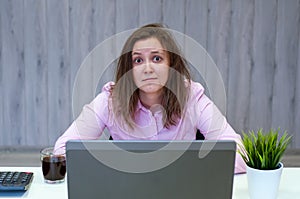 Young beautiful business woman suffering stress working at office computer desk feeling tired and desperate looking overworked