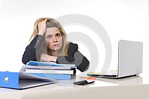 Young beautiful business woman suffering stress working at office computer desk load of paperwork