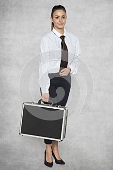 Young and beautiful businesswoman in elegant work clothes