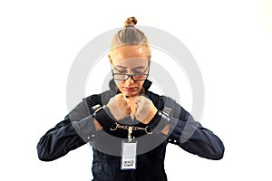Young beautiful businesswoman screaming, prisoner of job in cuffs