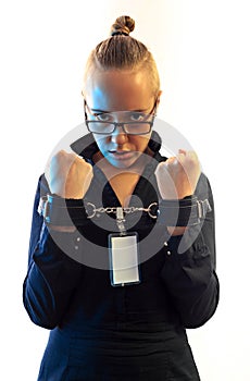 Young beautiful businesswoman screaming, prisoner of job in cuffs