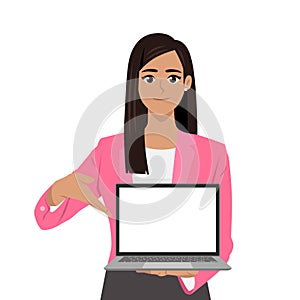 Young beautiful businesswoman showing a blank screen laptop and pointing finger