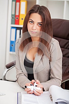 Young and beautiful businesswoman tired from work in the office.